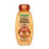 Garnier Whole Blends Honey Treasures Repairing Shampoo bottle for dry, damaged hair: 12.5 fl oz packaging featuring a 3 honey complex of acacia, manuka, and lavender honey to repair split ends, breakage, and dryness.
