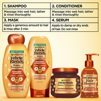 Complete Garnier Whole Blends Honey Treasures repairing system: 4-step routine including repairing shampoo, conditioner, rich repairing mask, and hair honey serum for healthy, moisturized hair.