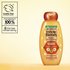 Garnier Whole Blends Honey Treasures Repairing Shampoo hero shot: highlighting cruelty-free international certification, the bee conservancy partnership, and a bottle made of 100% recycled plastic.