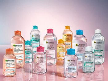 Several bottles of Garnier Micellar Cleansing Water in various sizes and colors are displayed, highlighting the product and its variations.