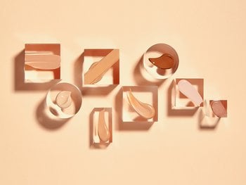 Various shades of BB cream are displayed in square frames against a light orange background.