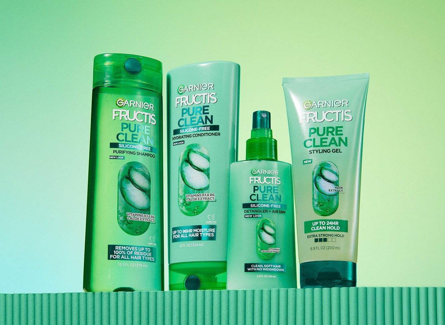 Group shot of Pure Clean Collection in front of green background.