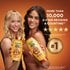 Two women holding the Garnier Honey Treasures shampoo and conditioner bottles.